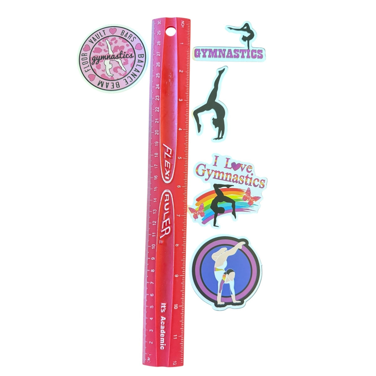 A set of gymnastics-themed stickers displayed next to a red plastic ruler for scale on a plain white background.