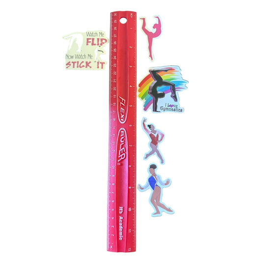 A red plastic ruler with gymnast illustrations and text stickers, shown on a plain white background.