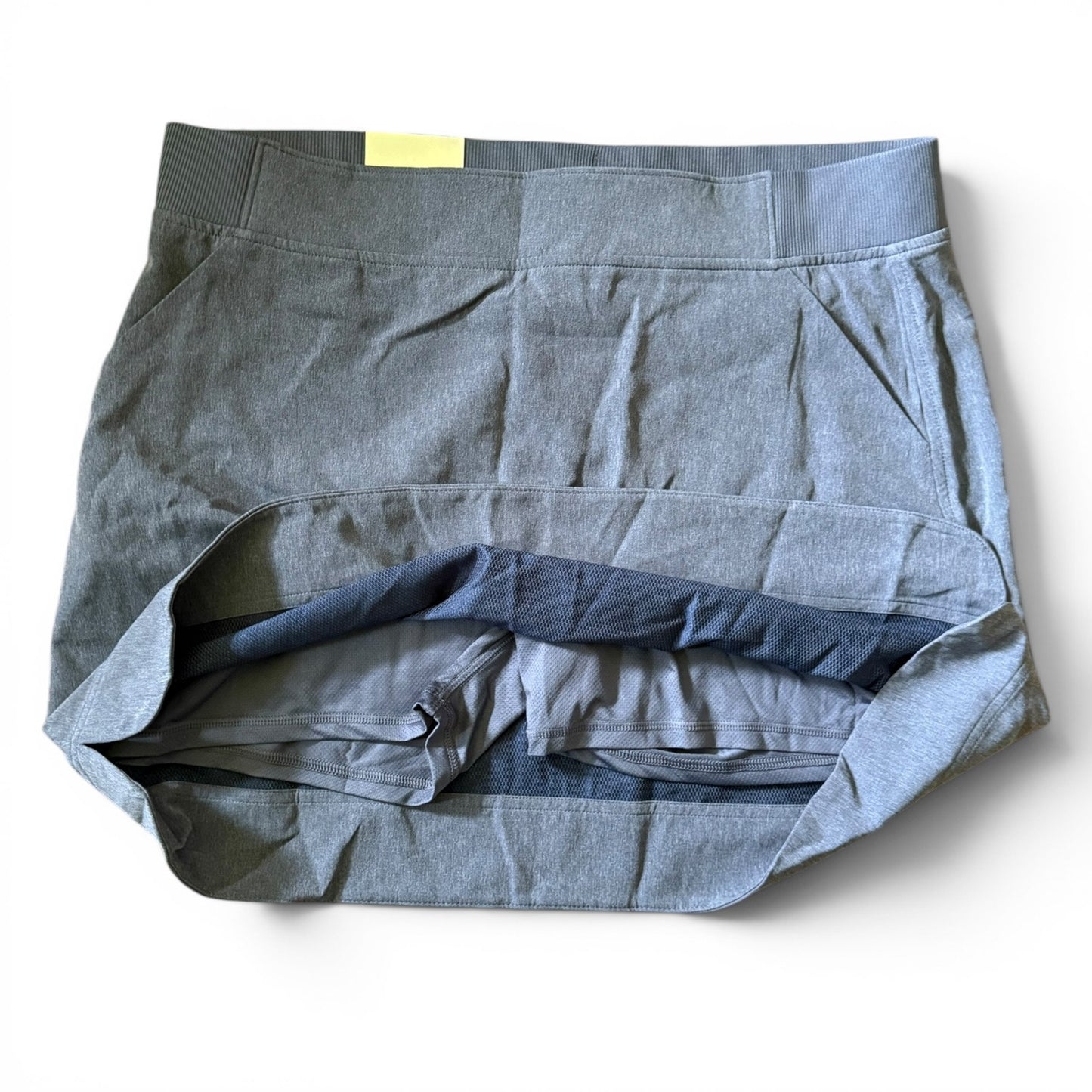 Blue skort showing shorts on a white background