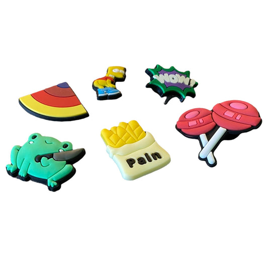 Set of colorful shaped shoe charms in various styles on a white background