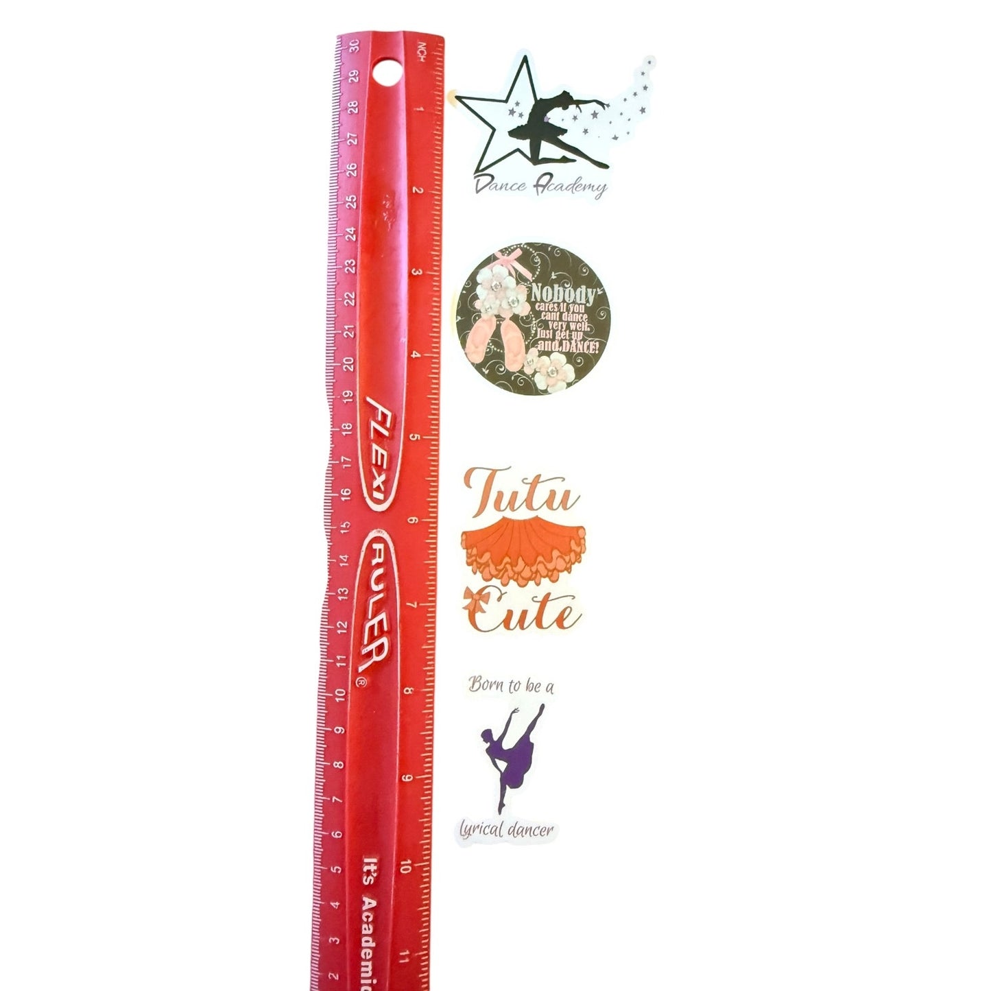 Red ruler with decorative stickers and graphics on a white background