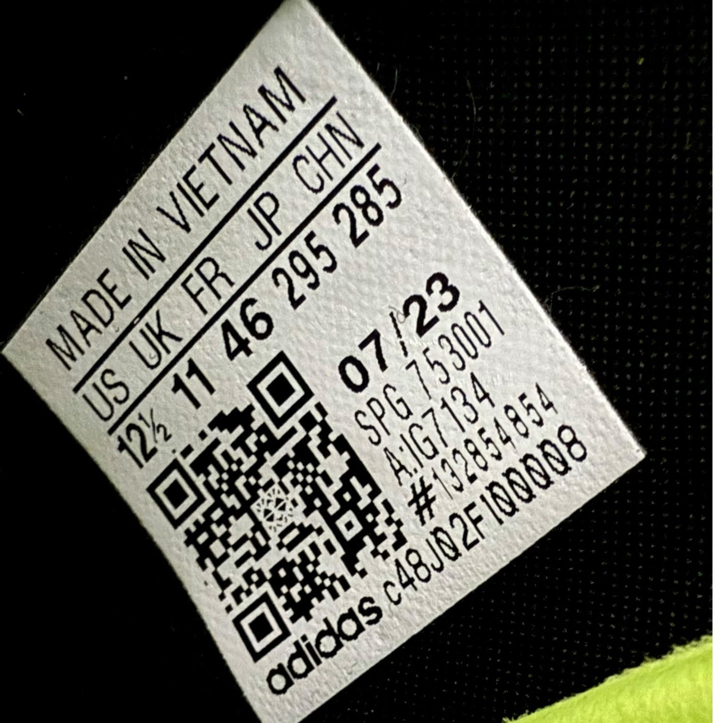 Product label with text and QR code on a black background