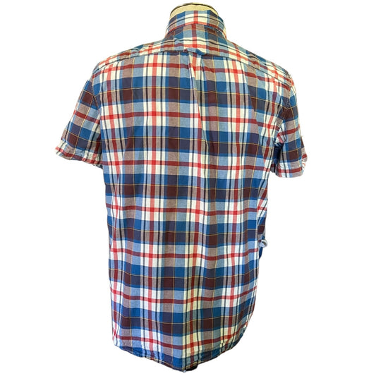 A short-sleeve plaid button-up shirt shown from the back, featuring a blue, red, white, and brown checkered pattern on a white background.