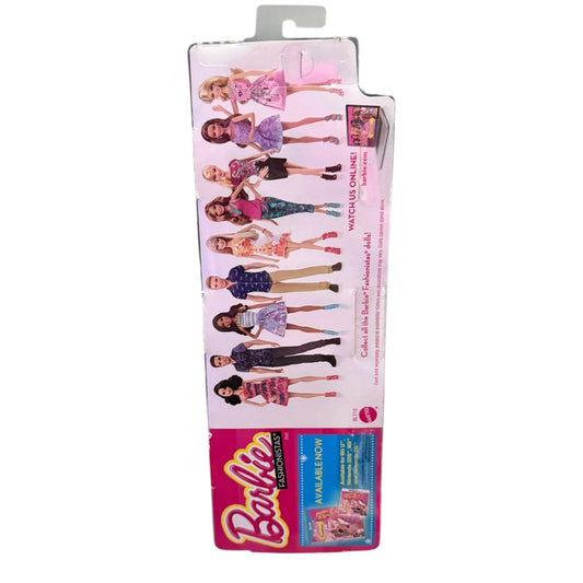 Back of Barbie doll in packaging on a white background