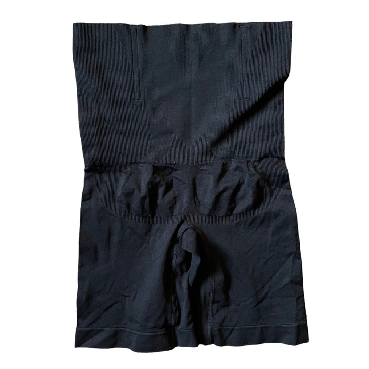 Black high waisted shapewear laid flat on a white background.