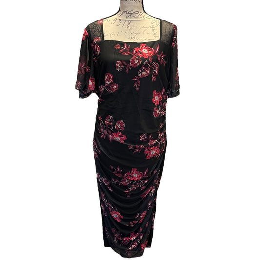 Front of Black dress with red floral pattern on a mannequin against a white background