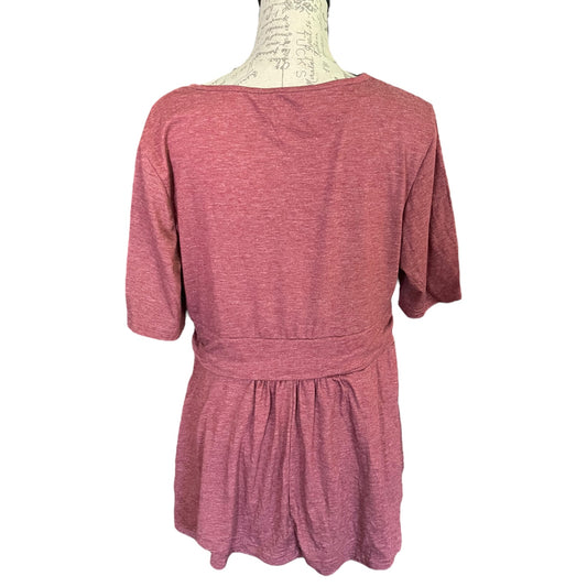 A heathered dusty rose pink short-sleeve top displayed on a dress form mannequin against a plain white background.
