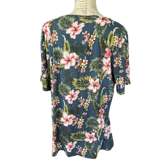 Floral patterned shirt on a mannequin against a white background