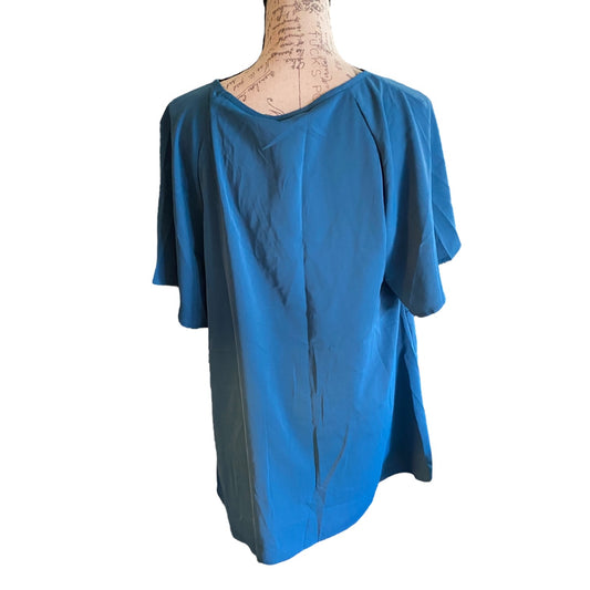 A short-sleeve top displayed on a dress form mannequin against a plain white background.