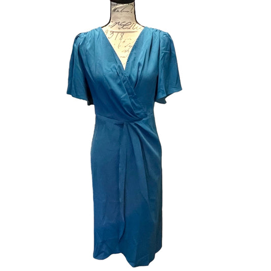 Blue dress on a mannequin against a white background