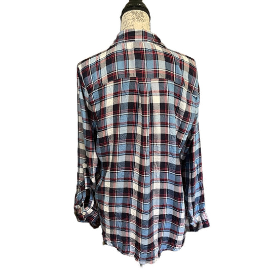A long-sleeve plaid button-up shirt displayed on a dress form mannequin against a plain white background.
