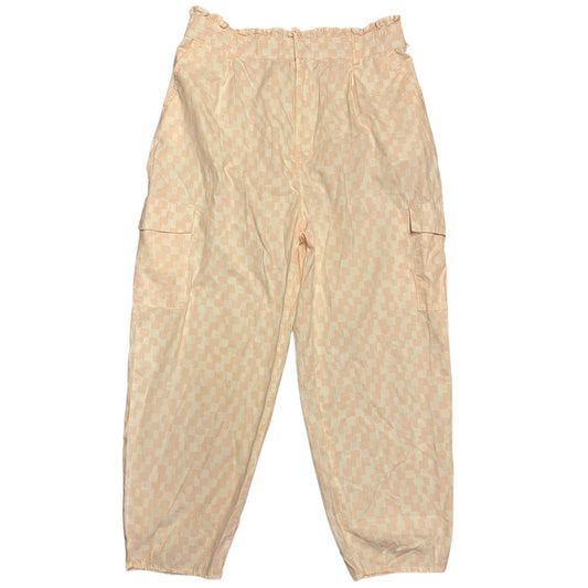 Back of pink and ivory checkered pants on a white background