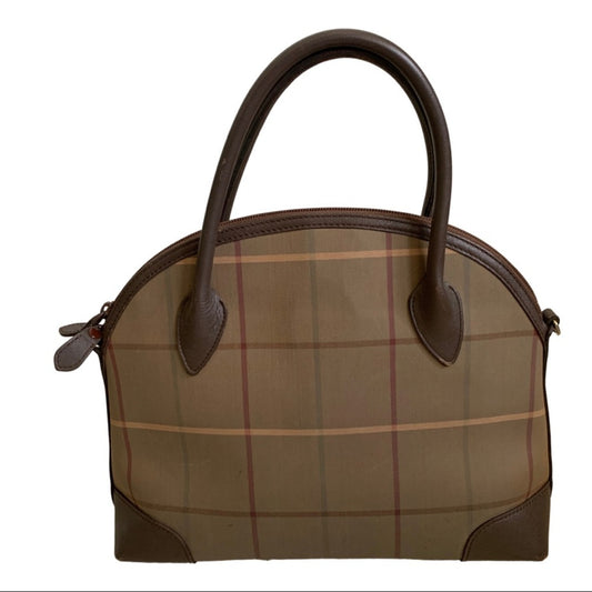 Brown plaid handbag with brown leather handles on a white background