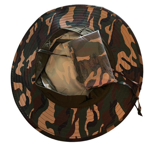 A camouflage boonie hat shown from a top-down view, featuring a green, brown, and tan camo pattern with a clear plastic face shield attached inside the brim.