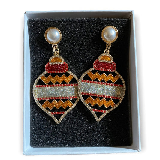 Decorative earrings with geometric holiday patterns in a box