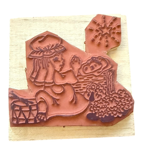 Decorative rubber stamp on a light wood background