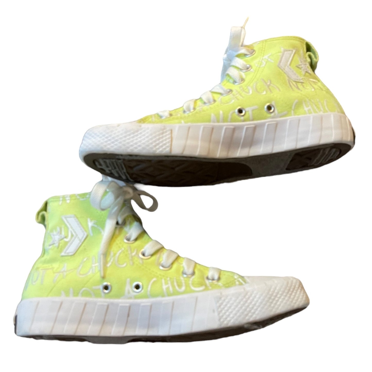 Pair of green high-top sneakers with white soles on a white background