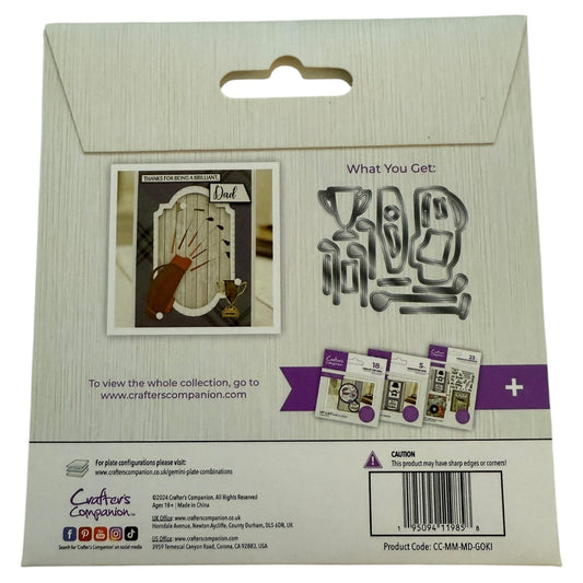 Package of Crafters Companion metal dies with a card and stamps on a white background