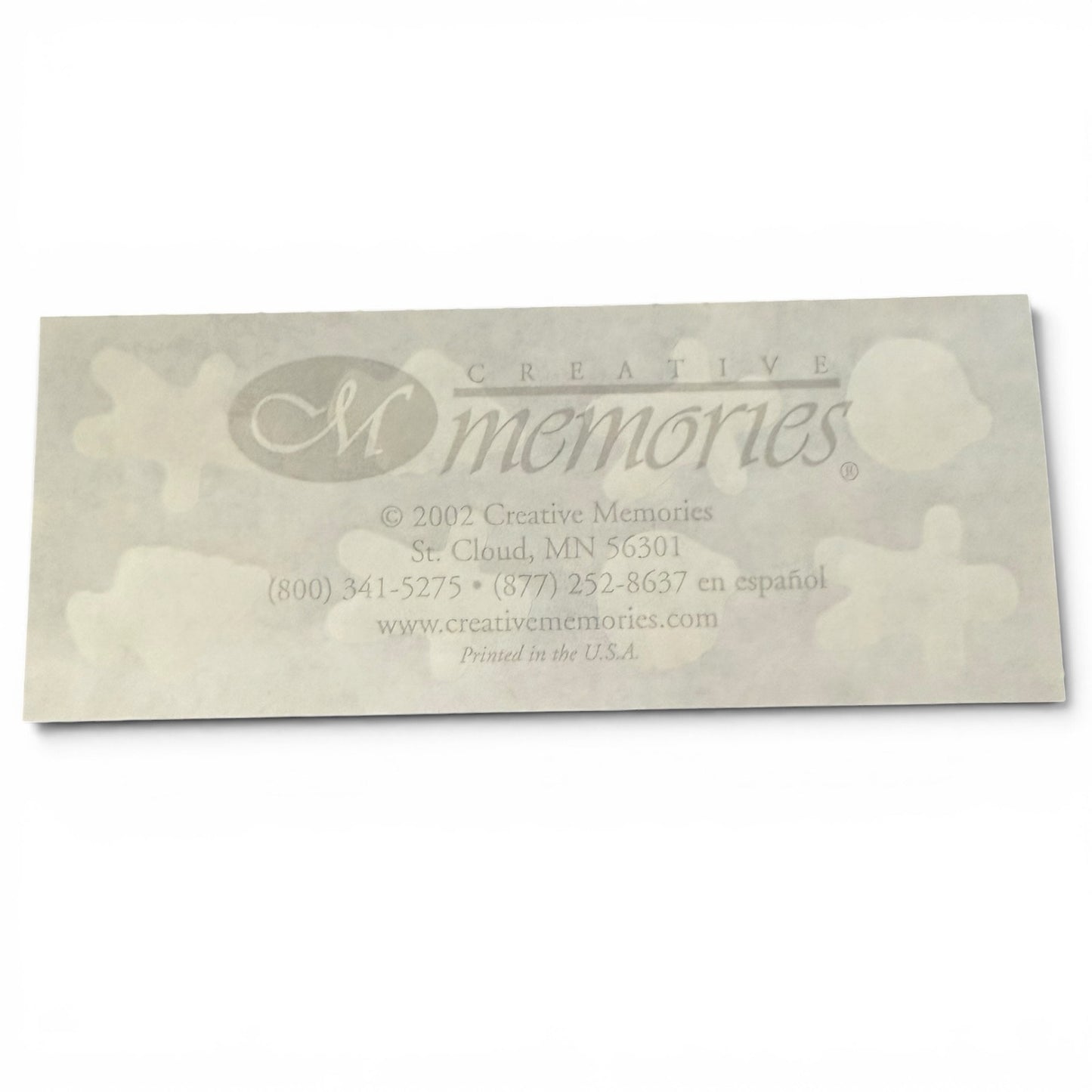 Back of sticker sheet with 'Creative Memories' logo and contact information on a white background