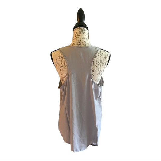 A sleeveless light gray top displayed on a dress form mannequin against a plain white background.