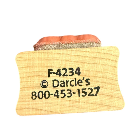 Wooden stamp with 'F-4234' and 'Darcie's' branding on a white background