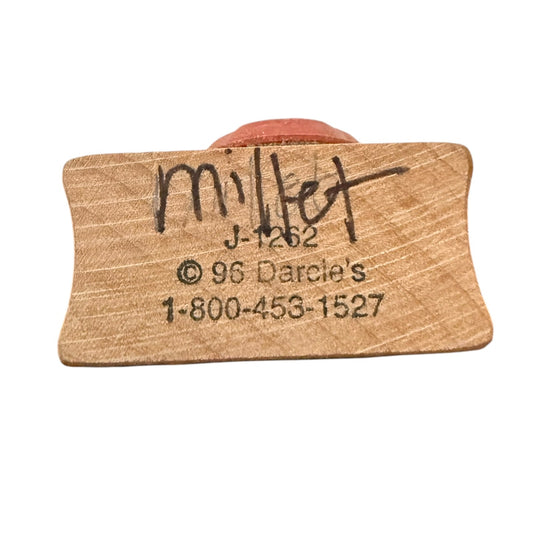 Wooden stamp, showing engraved text including 'millet', 'J-1262', '© 96 Darce's', and a phone number.