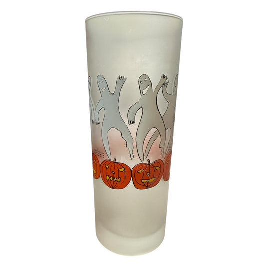 Frosted glass tumbler with Halloween-themed design of ghosts and pumpkins on a white background