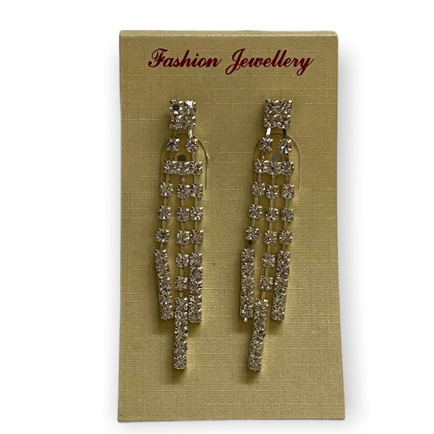 A pair of dangling CZ earrings displayed on a beige jewelry card labeled 'Fashion Jewellery' against a white background.