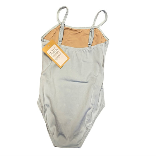 A blue leotard with thin shoulder straps, a tan lining, and a yellow brand tag attached, shown against a plain white background.