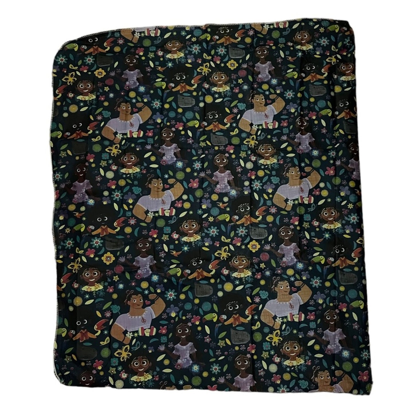 A square dark blue tablecloth with cartoons on it on a white background
