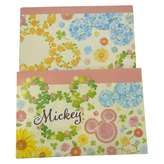 Floral patterned stationery with 'Mickey' text and logo on a white background