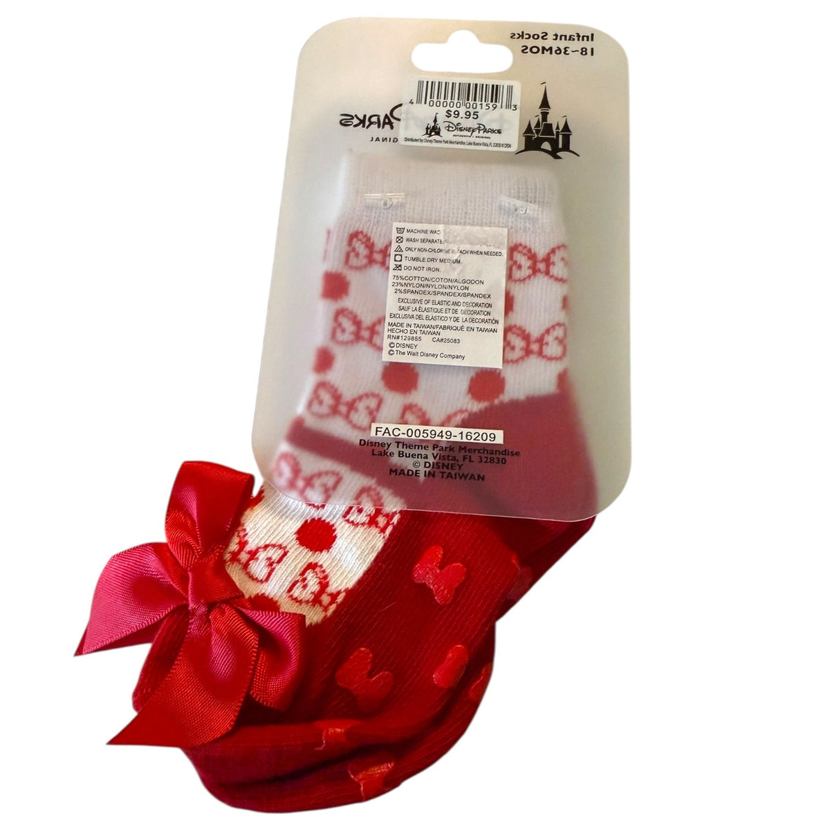 A pair of Disney-themed socks in red and white, featuring a red ribbon bow and polka dot patterns, shown in their original clear plastic packaging with a cardboard header.
