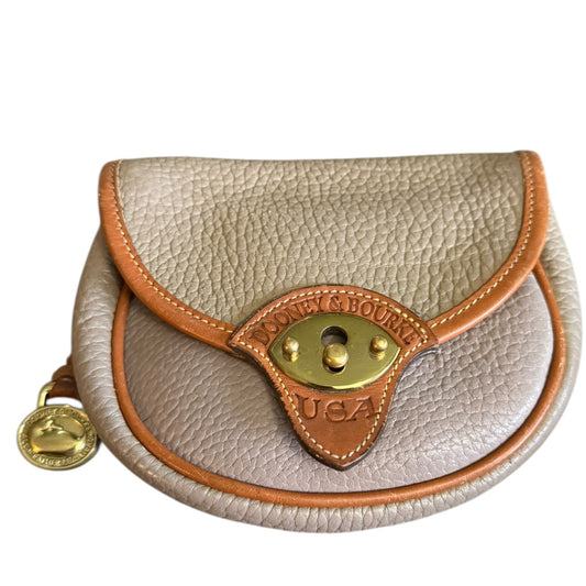 Front of Small leather pouch with gold accents and 'Dooney & Bourke' branding on a white background