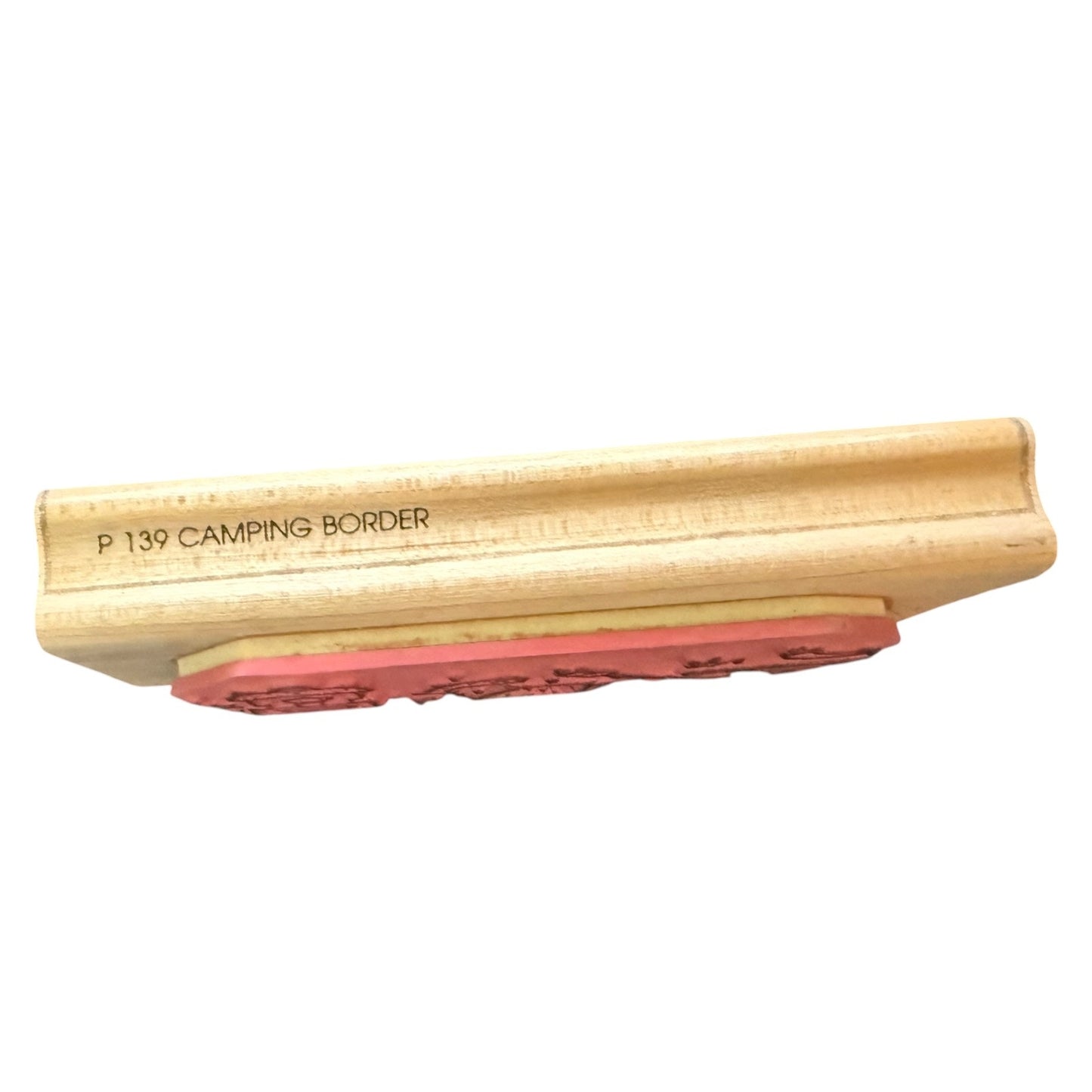 Wooden block with red rubber on a white background