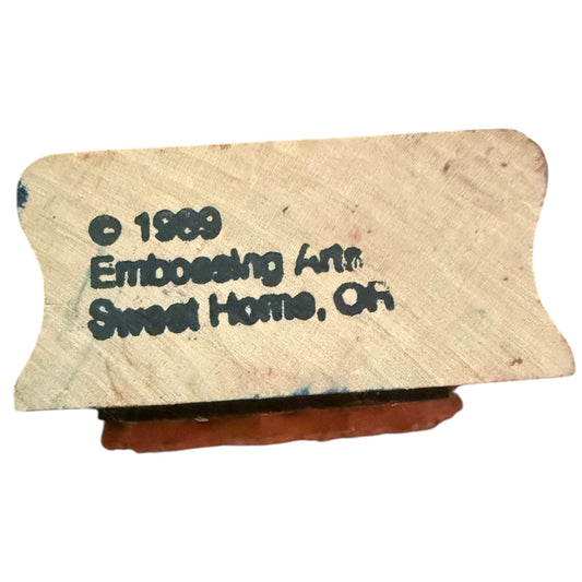Vintage embossing tool with '1989 Embossing Art Sweet Home, OR' text on a white background