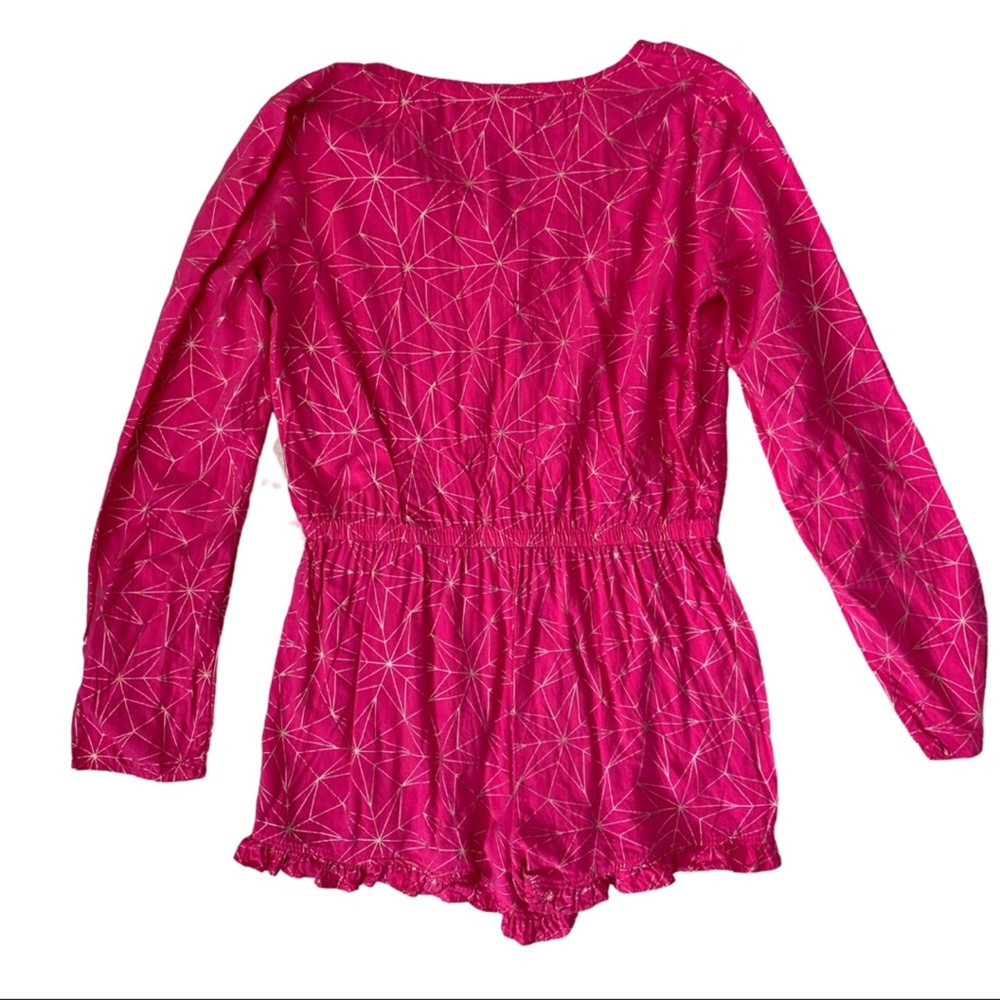 A bright pink long-sleeve romper with a geometric star pattern on a white background