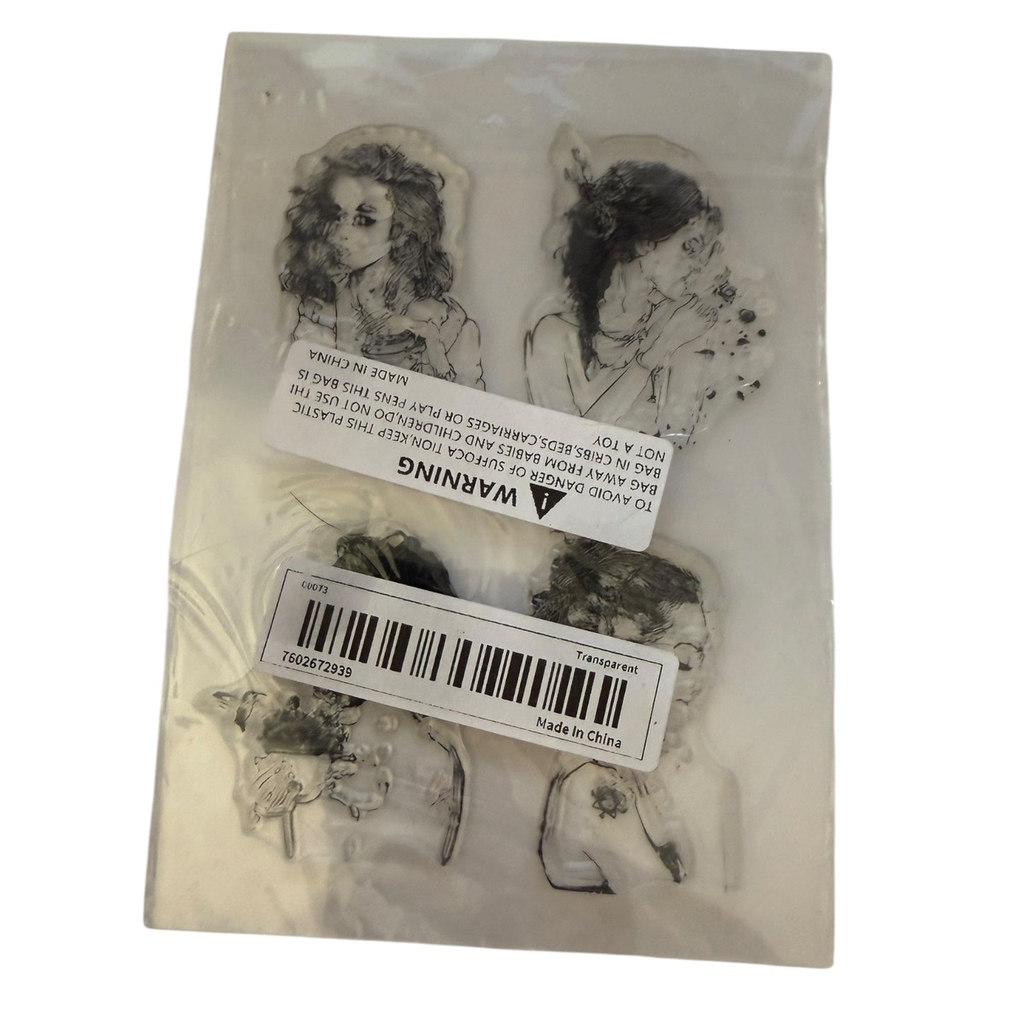 A package of four clear rubber stamps featuring black and white line-art illustrations of women, sealed in a clear plastic bag with product labels and a barcode sticker.