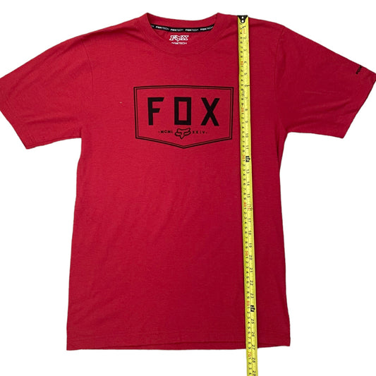 Red t-shirt with a black 'FOX' logo and a yellow measuring tape on a white background