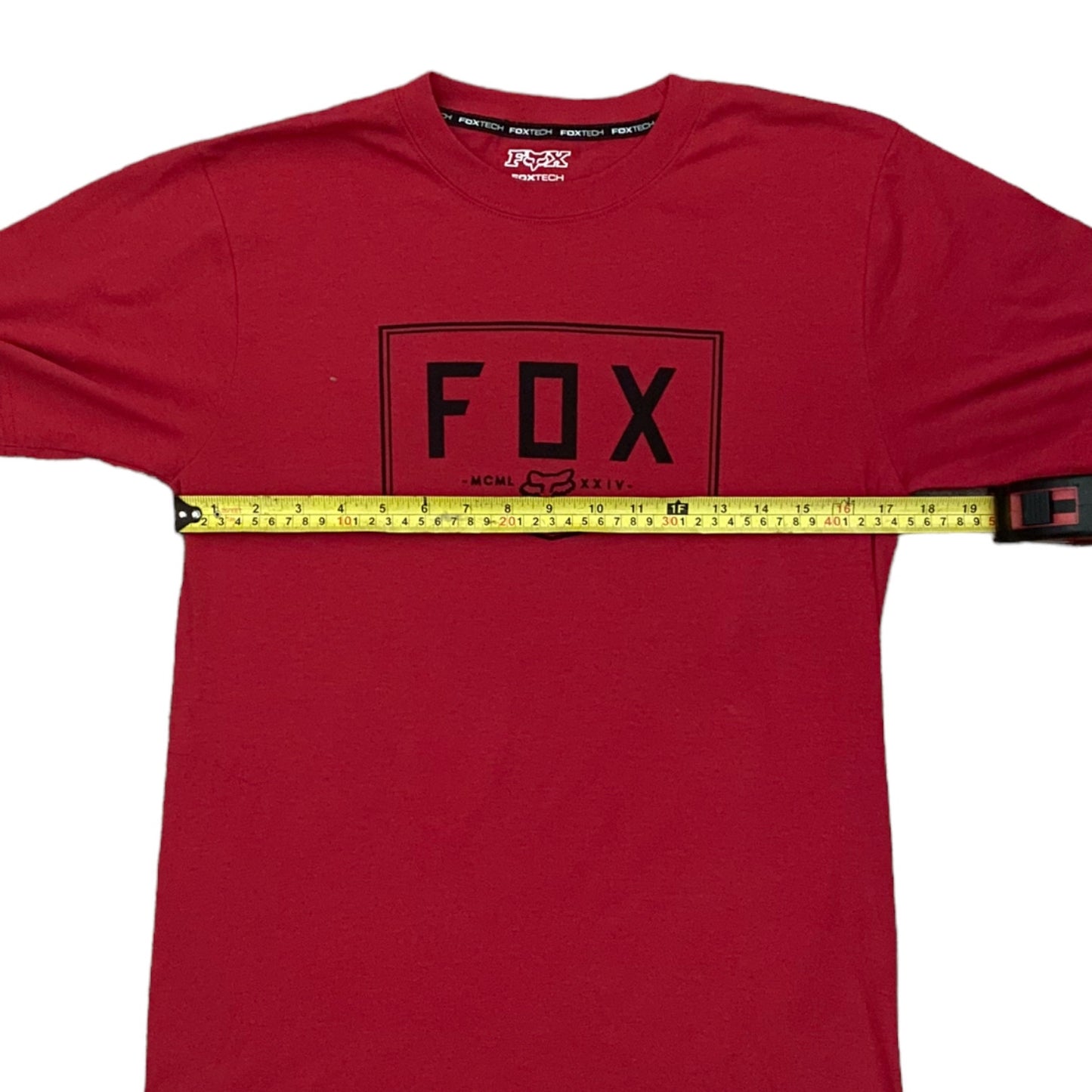 Red t-shirt with 'FOX' logo and measuring tape design on a white background