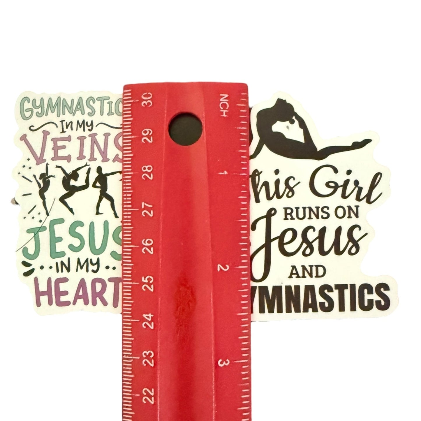 Red ruler with motivational quote stickers on a white background