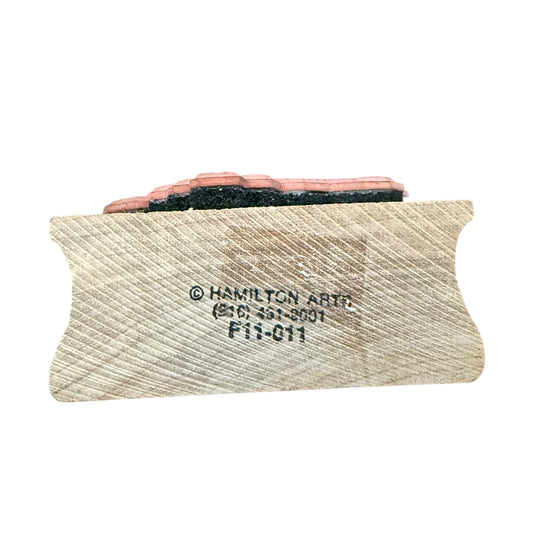 Sanding block with sandpaper and Hamilton Artco branding on a white background