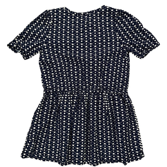 A short-sleeve peplum dress with an all-over white ditsy floral print on a dark navy blue background, shown flat against a white background.