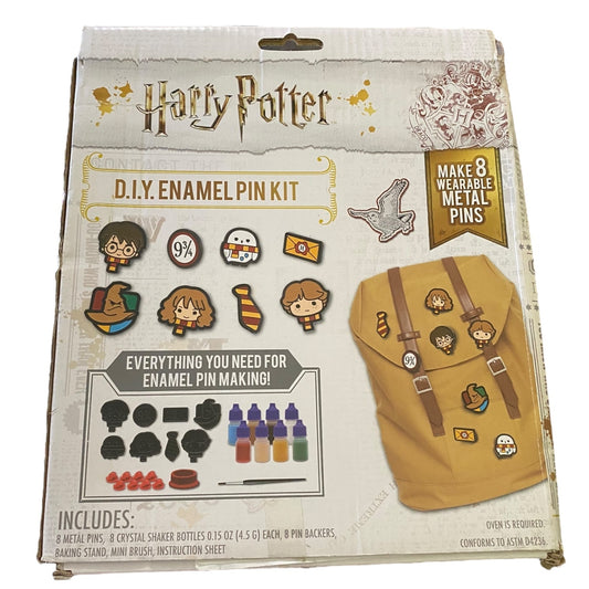 Harry Potter DIY Enamel Pin Kit packaging with illustrations of pins and a backpack.