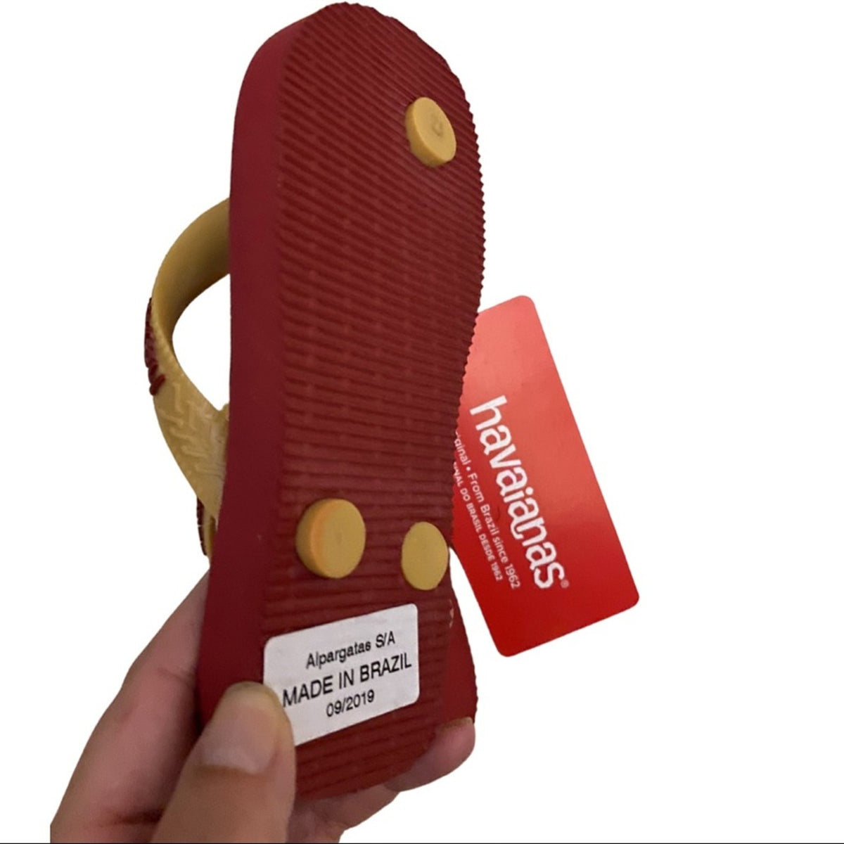 Bottom of Harry Potter flip flops ona white background.