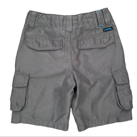 Gray cargo shorts with a brand label on a white background
