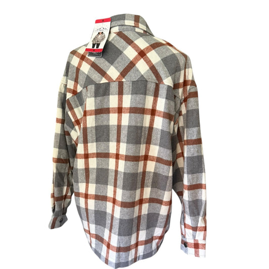 A long-sleeve plaid flannel shacket, shown from the back with its retail tag still attached. The shirt features a classic plaid pattern in gray, off-white, and rust brown.