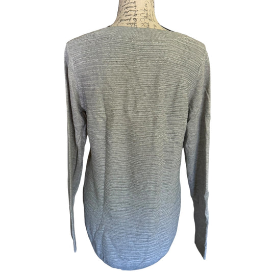 A light gray ribbed knit long-sleeve sweater displayed on a mannequin torso against a plain white background.