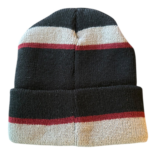 Back of Knitted beanie with black, red, and beige stripes on a white background