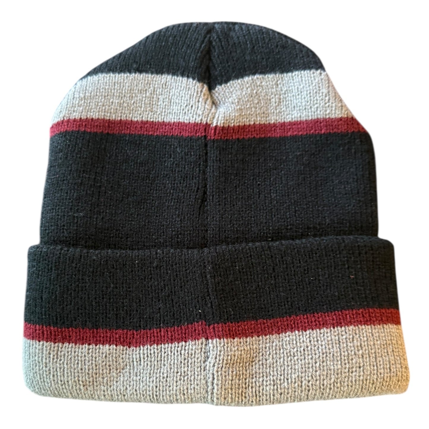Back of Knitted beanie with black, red, and beige stripes on a white background