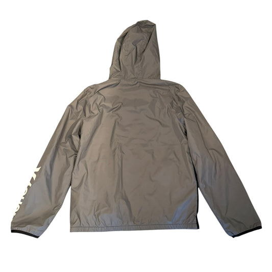 A gray hooded jacket shown from the back, laid flat against a white background. A white graphic print is visible on the left sleeve.
